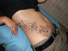 a woman with a tattoo on her stomach