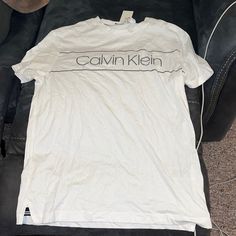 White Calvin Klein T Shirt Short Sleeve. Size Medium. Brand New With Tags Never Worn. Calvin Klein Crew Neck T-shirt For Spring, Calvin Klein Relaxed Fit Crew Neck T-shirt, Calvin Klein Graphic Tee Short Sleeve T-shirt, Calvin Klein Graphic Tee Crew Neck, Calvin Klein Logo Print Crew Neck T-shirt, Calvin Klein Graphic Tee Short Sleeve, Calvin Klein Graphic Tee With Crew Neck, Calvin Klein Crew Neck T-shirt With Logo, Calvin Klein Graphic Tee With Short Sleeves