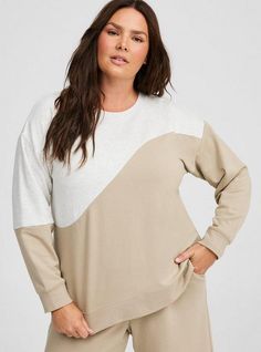 Matching Style(s): Search 43030199 FIT Model is 5'10” wearing size 1. . Measures 30” from shoulder (size 2). . MATERIALS + CARE Super Soft Fleece knit fabric: A luxuriously soft and comfy fleece with tons of stretch. Stretch level: Maximum. 57% cotton, 38% polyester, 5% spandex. Machine wash cold. Tumble dry low. Imported. DETAILS Crew neck. Long sleeves. Drop shoulder. . The best plus size women's super soft fleece crew neck drop shoulder sweatshirt sweatshirts & hoodies in plaza taupe colorblock made of supersoftfleece. Torrid is your destination for cozy fall and winter clothes to keep you warm and comfortable. Neutral Cotton Long Sleeve Sweatshirt, Neutral Long Sleeve Sweatshirt For Spring, Neutral Long Sleeve Spring Sweatshirt, Neutral Long Sleeve Top For Loungewear, Off White Tops For Fall Loungewear, Off White Tops For Loungewear In Fall, Cream Crew Neck Top For Loungewear, Off White Long Sleeve Tops For Loungewear, Drop Shoulder Sweatshirt