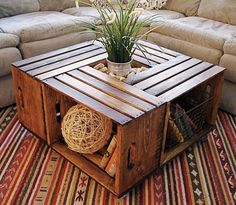 a coffee table made out of pallet wood with a potted plant on top