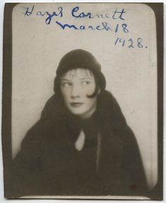 an old black and white photo of a woman wearing a fur coat with her eyes closed