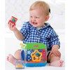 a baby sitting on the floor playing with toys