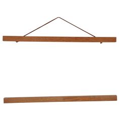 a wooden shelf hanging on a wall with a long string attached to it and two small hooks