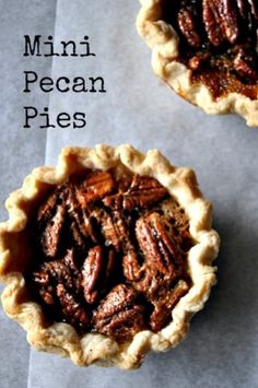 two pecan pies sitting next to each other on top of a piece of paper