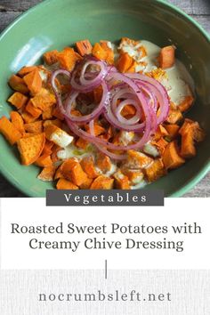 roasted sweet potatoes with creamy chive dressing in a green bowl on a wooden table