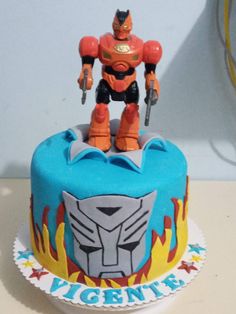 a birthday cake with an image of a robot from the movie's tv series