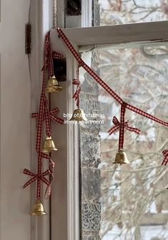 bells hanging from the side of a window