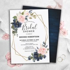 an elegant floral bridal shower is displayed on top of a blue and white card