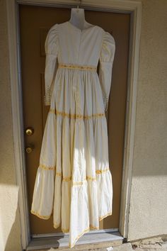 "Prairie dress. No tags - looks hand made. Very heavy. Zips in the back. In good condition!. I would guess it to be a size small- please see measurements. Measurements taken across front laid flat 18\" across front armpit to armpit 14.5\" across front of empire waist 56\" length" Fall Maxi Dress With Lace Trim, Maxi Dress With Lace Trim For Fall, Lace Trim Maxi Dress For Fall, Fitted Long Sleeve Victorian Retro Dress, Vintage Full Length Dress With Lace Trim, Fall Wedding Victorian Dress With Long Sleeves, Fall Wedding Victorian Long Sleeve Dress, 1970s Long Sleeve Fitted Prairie Dress, 1970s Style Fitted Prairie Dress With Long Sleeves