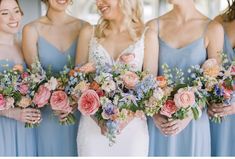 a group of women standing next to each other holding bouquets