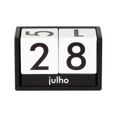 a black and white clock with the number twenty eight on it's side, in front of a white background