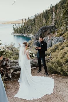 a bride and groom standing next to each other