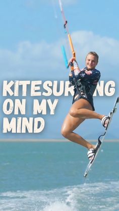 a woman is kiteboarding on the water with words above her that read kitesurfing on my mind