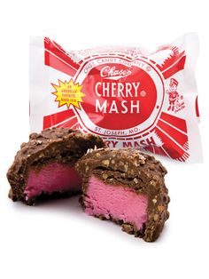 a chocolate and raspberry candy bar next to a bag of cherry mash