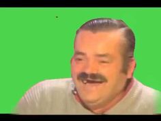 a man with a moustache on his face is making a funny face in front of a green screen