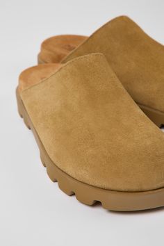 Casual Suede Clogs With Cork-bed Midsoles, Casual Suede Clogs With Textured Footbed, Casual Suede Clogs With Leather Footbed, Casual Suede Mules With Rubber Sole, Modern Outdoor Clogs With Rubber Sole, Casual Suede Mules For Outdoor, Modern Slip-on Outdoor Clogs, Modern Slip-on Clogs For Outdoor, Outdoor Suede Closed Toe Clogs