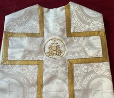 Chasuble for boys' to 'play' Mass and imitate Father.  -Buy 6 get 20% off Made in Liturgical brocade embroidered with crosses of two kinds, the same fabric used to make Father's chasuble for use on the Altar. It is lined with caramel/gold satin and interlined with stiffening fabric to give it shape and weight just like Father's chasuble. It can be made in 6 liturgical colors and 4 sizes to fit your young son ages 2-12.  It has a handmade cross of gold ribbon made to fit each individual chasuble. Stiffening Fabric, Priest Clothes, Saint Costume, Priest Vestments, Priest Costume, Boys Costumes, Liturgical Colours, Cross Applique, Gold Applique