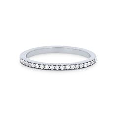 a white gold wedding band with diamonds on the side, set in 18k white gold