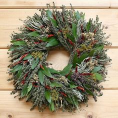 a wreath is hanging on a wooden wall