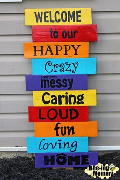 a sign that says welcome to our happy crazy messy caring loud loving home on it