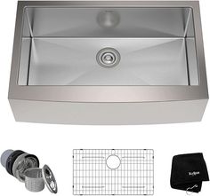 stainless steel kitchen sink with accessories including strainer, strainer and cleaning cloths