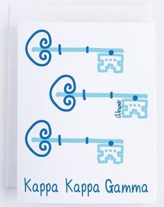 three blue keys on a white card that says kapa kappa gamma