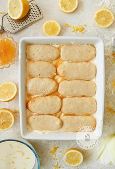 sliced lemons and slices of bread in a baking dish