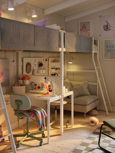 there is a loft bed with a desk in the middle and bunk beds above it