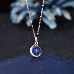 The moon engagement pendant necklace are a popular choice, represents I LOVE YOU TO THE MOON AND BACK , used to express the vastness of one's affection for another. HOW TO STYLE : it is the most versatile and elegant statement necklace for casual days in the office and nights out. It's your go-to statement piece whatever the occasion. It also can be personalized to show your uniqueness in the party, date, banquet. PERFECT FOR GIFTING: This star blue sapphire necklace is classic and never go out of style,  packaged in delicated gift box , It's a good choice of an anniversary, engagement, birthday, Mother's Day gifts, Christmas day, Thanksgiving Day, Valentine's Day gift for a couple, friend, family. AFTER-SALE SERVICE : 30 days money-back guarantee and for any reason, you are not satisfied Blue Star Necklace, Blue Round Pendant Necklace For Wedding, Blue Round Pendant Necklaces For Weddings, Elegant Blue Jewelry With Moon Charm, Blue Star Jewelry With Moon Charm, Blue Clavicle Chain Necklace For Wedding, Celestial Pendant Jewelry For Wedding, Blue Crescent Sterling Silver Necklace, Elegant Blue Moon-shaped Necklace