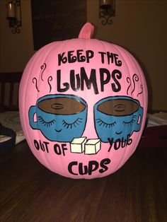 a pink pumpkin decorated with coffee mugs and the words keep the lumps out of your cups