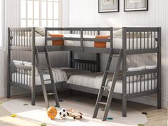 bunk beds with ladders are in the corner of a room that has white walls and wooden floors