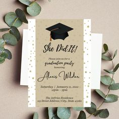 a graduation party card with a mortar cap on it and greenery in the background