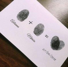 a close up of a paper with two finger prints on it