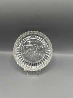 a glass plate with a silver design on it