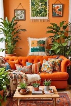 a living room filled with furniture and lots of plants on top of the couches