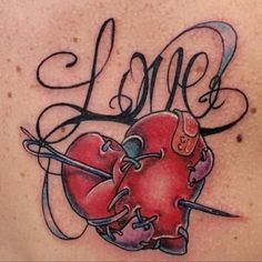 a tattoo with the word love written on it