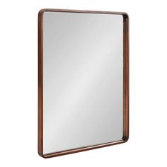 a mirror that is on the wall with a wooden frame and metal trimmings