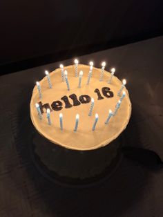 a birthday cake with lit candles on it