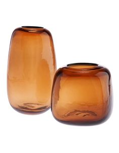 two brown vases sitting next to each other