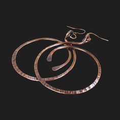 "Big hammered distressed / textured copper hoops. These Large Hoops are handmade and hammered by hand. Big Hoops are the Trend this year. Oversized Copper Hoop Earrings antiqued for and aged look. Made from 10 gauge wire these earrings are solid and sturdy. Rustic Copper Earrings with wonderful aged antiqued patina.  Size is 2-3/8\" Wide by 3\" tall. Made To Order. COPPER IS A CONDUCTOR OF POSITIVE ENERGY! A perfect, meaningful gift for that special person. Copper jewelry is always a nice sentim Hammered Copper Hoop Jewelry, Hammered Copper Round Hoop Earrings, Small Copper Hoop Jewelry, Hammered, Electroformed Metal Hoop Earrings, Artisan Electroformed Hoop Earrings, Electroformed Brass Hoop Earrings, Hammered Bronze Metal Hoop Earrings, Bronze Hammered Metal Hoop Earrings, Hand Forged Bronze Hoop Earrings