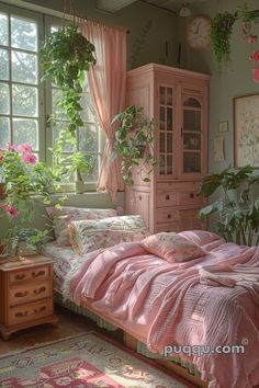 a bedroom with pink linens and plants in the window sill, along with an antique dresser