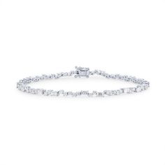 This distinctive tennis bracelet features round brilliant cut and baguette cut diamonds totaling 2.09 carats scattered throughout. Timeless Diamond White Tennis Bracelet With Baguette Cut, Classic White Tennis Bracelet With Baguette Diamonds, White Baguette Diamond Tennis Bracelet, White Tennis Bracelet With Baguette Diamonds, Classic Diamond White Tennis Bracelet With Baguette Diamonds, Timeless Baguette Cut Cubic Zirconia Tennis Bracelet, Timeless Baguette-cut Cubic Zirconia Tennis Bracelet, Timeless Cubic Zirconia Tennis Bracelet With Baguette Cut, Classic Tennis Bracelet With Baguette Diamonds