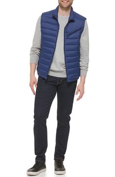 Update your cold-weather collection with this quilted puffer vest that's a versatile must-have layering piece. 26.5" length (Size M) Stand collar Sleeveless Zip front Slanted zipper chest pocket 100% nylon Machine wash cold Imported Model stats: 6'1" height, 32" waist. Model is wearing size M. Outdoor Nylon Puffer Vest, Navy Puffer Vest, Quilted Puffer Vest, Puffer Vest, Cole Haan, Layering Pieces, Stand Collar, Chest Pocket, Nordstrom Rack