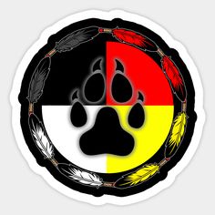 a black, red, yellow and white bear paw with feathers in a circle shape