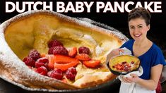 a woman holding a plate with some fruit in it and the words dutch baby pancake