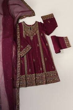 A beautiful festive look in the captivating shade of eggplant purple, crafted on pure raw silk, heavily embellished with gold & antique zardozi craftsmanship, each stitch is a testament to generations of artistry. Completing this masterpiece of a design is a gorgeous fully embellished soft pure tissue shawl, alongs Elegant Purple Sets With Intricate Embroidery, Gold Jamawar Anarkali Set With Intricate Embroidery, Gold Traditional Wear With Intricate Embroidery In Jamawar, Elegant Purple Salwar Kameez With Zari Work, Gold Jamawar Sharara With Dabka Work, Elegant Purple Set With Zari Work, Elegant Purple Sets With Zari Work, Festive Purple Unstitched Suit With Resham Embroidery, Elegant Purple Sets With Dabka Work