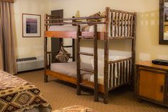 a bedroom with bunk beds and a dresser