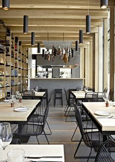 an empty restaurant with many tables and chairs