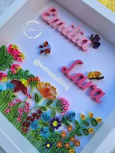 the word love spelled in 3d letters surrounded by flowers and butterflies