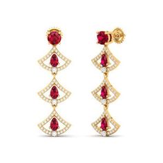 At the heart of these earrings lies the ruby, revered throughout history for its captivating red hue. With its deep crimson tones, the ruby evokes feelings of passion, desire, and vitality. Each gemstone within the Graduating Ruby Earrings seems to pulse with an inner flame, radiating warmth and energy that enchants all who behold them. Diamond weight is 0.69 & color stone weight is 2.44 NET WEIGHT (10K):4.90 NET WEIGHT (14K):5.51 NET WEIGHT (18K):6.59 Luxury Ruby Earrings With Prong Setting, Luxury Red Ruby Earrings, Luxury Ruby Gemstone Earrings, Red Ruby Diamond Earrings For Wedding, Elegant Ruby Diamond Earrings, Elegant Ruby Earrings With 17 Jewels, Elegant Gemstone Earrings With Lab-created Ruby, Classic Red Diamond Earrings, Ruby Earrings For Valentine's Day